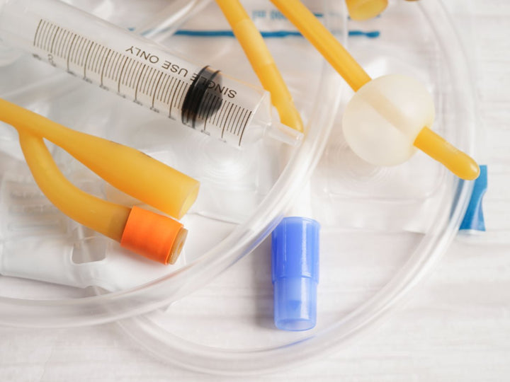 Picture of syringe with multiple tubes around