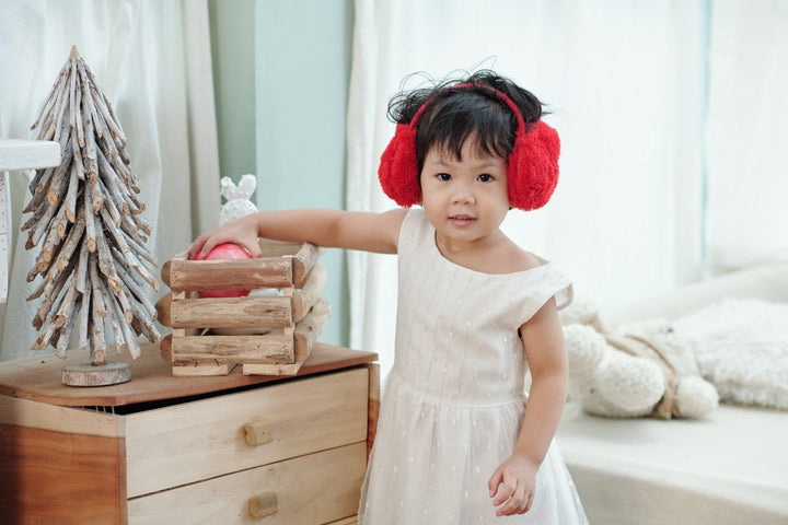Little Girl in Red Earmuffs